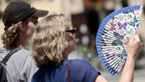Two people using fan